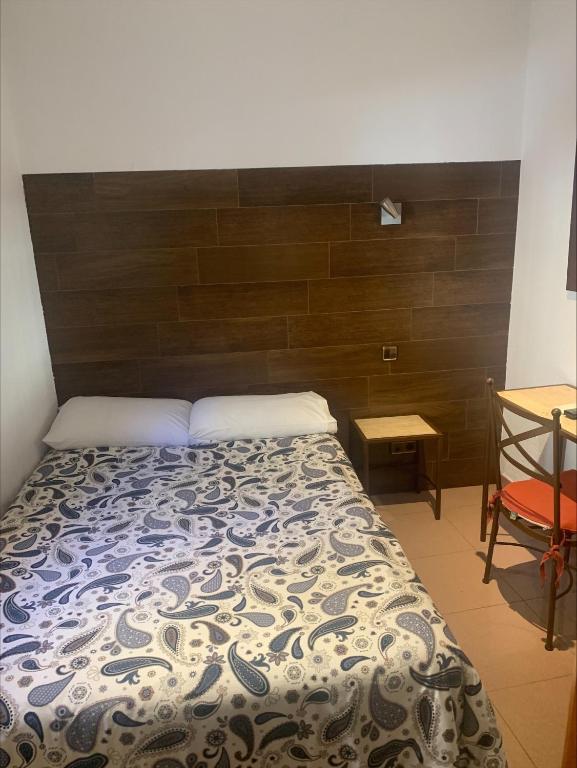 Postel nebo postele na pokoji v ubytování Hostal Sol