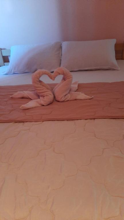 Postel nebo postele na pokoji v ubytování Apartmani Vesna