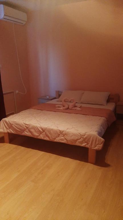 Postel nebo postele na pokoji v ubytování Apartmani Vesna
