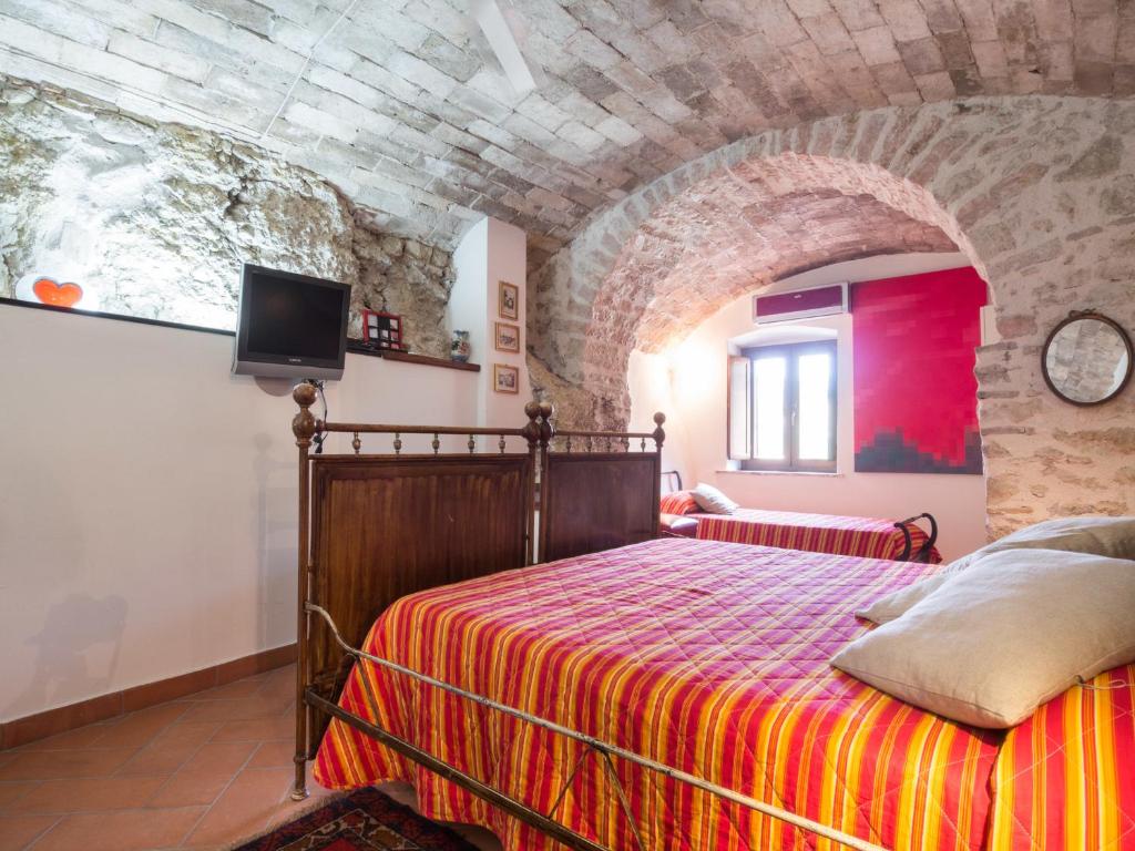 Postel nebo postele na pokoji v ubytování La Loggia Sul Nera