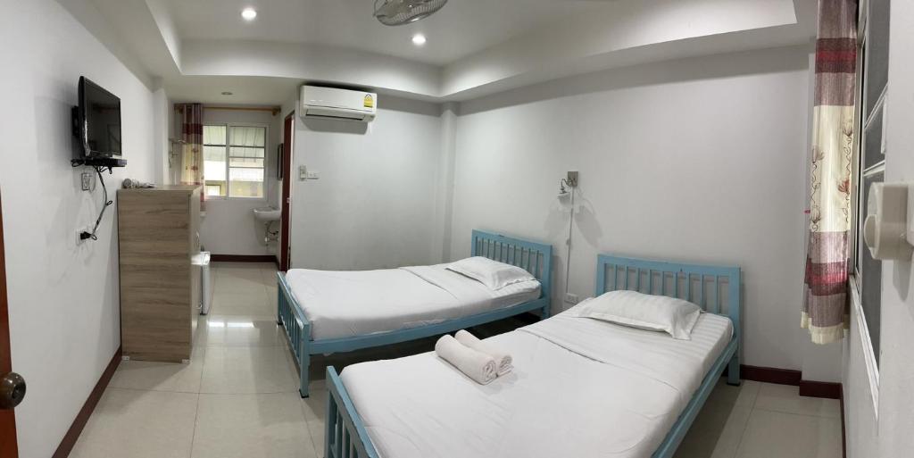 Postel nebo postele na pokoji v ubytování PSD Hotel