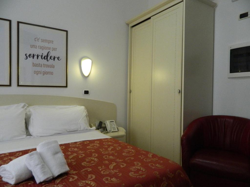 Łóżko lub łóżka w pokoju w obiekcie Hotel La Palazzina
