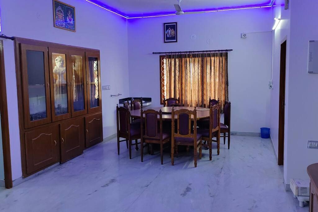 a dining room with a table and chairs at Ohm Shanthi Homestay in Puducherry