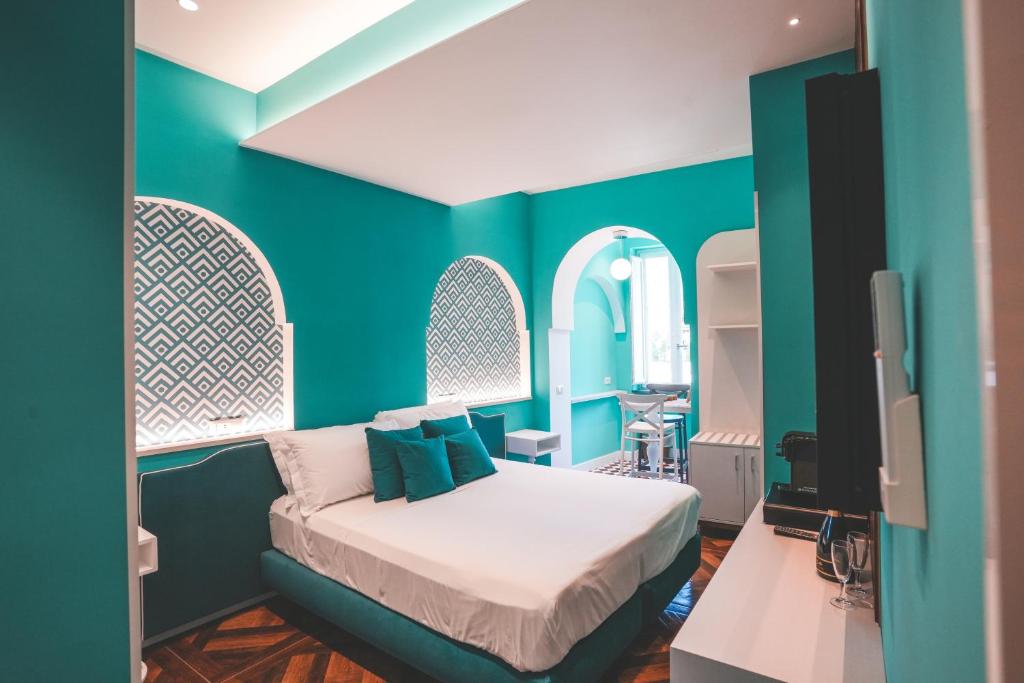 Postel nebo postele na pokoji v ubytování Cafè Latino Suites