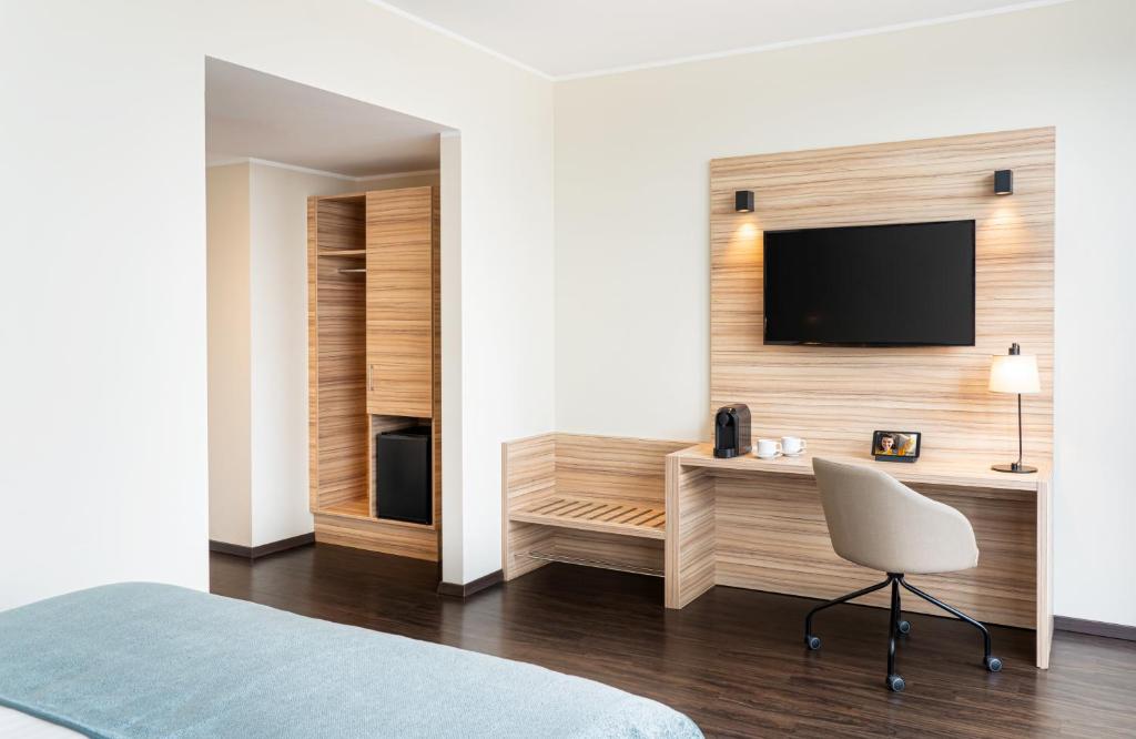 TV a/nebo společenská místnost v ubytování Leonardo Boutique Hotel Linz City Center