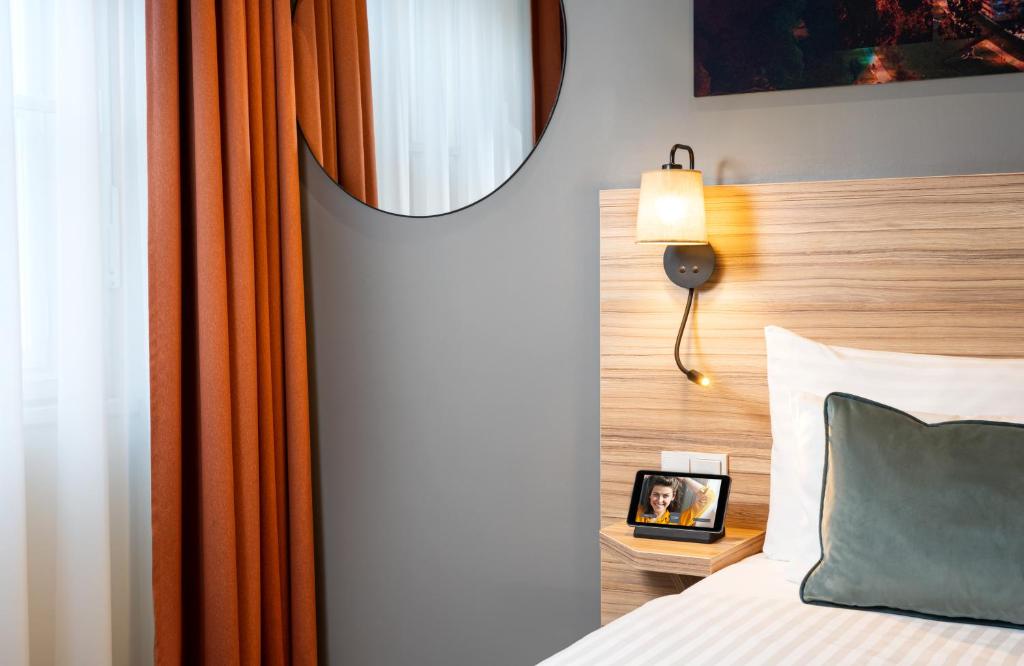 Postel nebo postele na pokoji v ubytování Leonardo Boutique Hotel Linz City Center