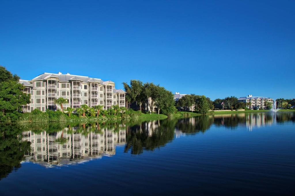 a view of a large building on a river at Marriott's Cypress Harbour Villas in Orlando