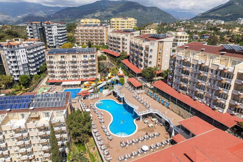 an aerial view of a city with buildings and a pool at Extrahome in Alanya