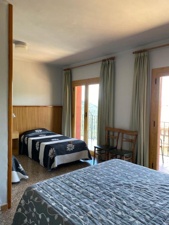 Postel nebo postele na pokoji v ubytování Hostal Alt Llobregat