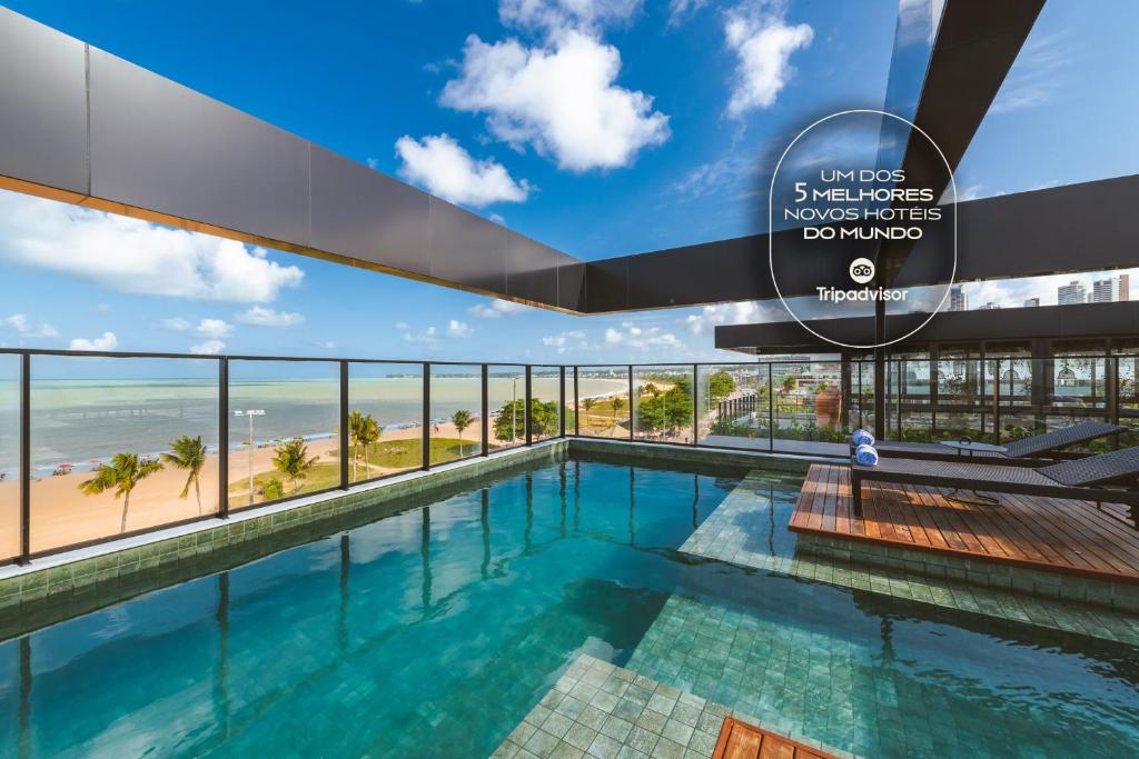 a view of the infinity pool at the beachfront hotel at BA'RA Hotel in João Pessoa