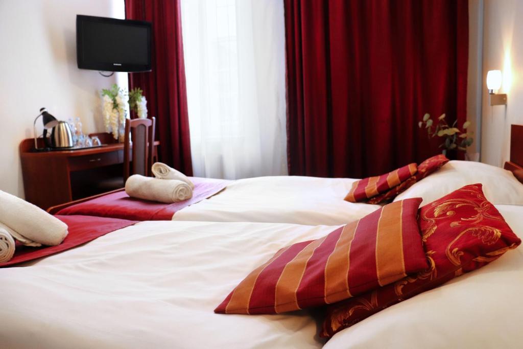 Posteľ alebo postele v izbe v ubytovaní Hotel Lothus