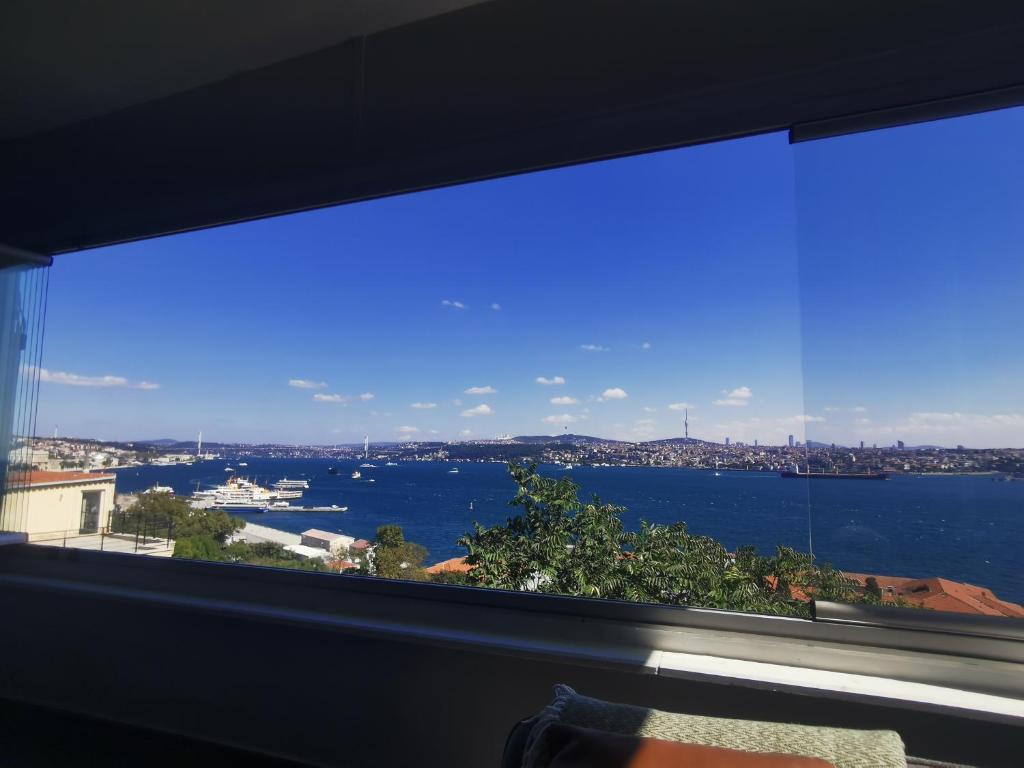 a large window with a view of the water at Bosphorus Menekshe Rezidances in Istanbul