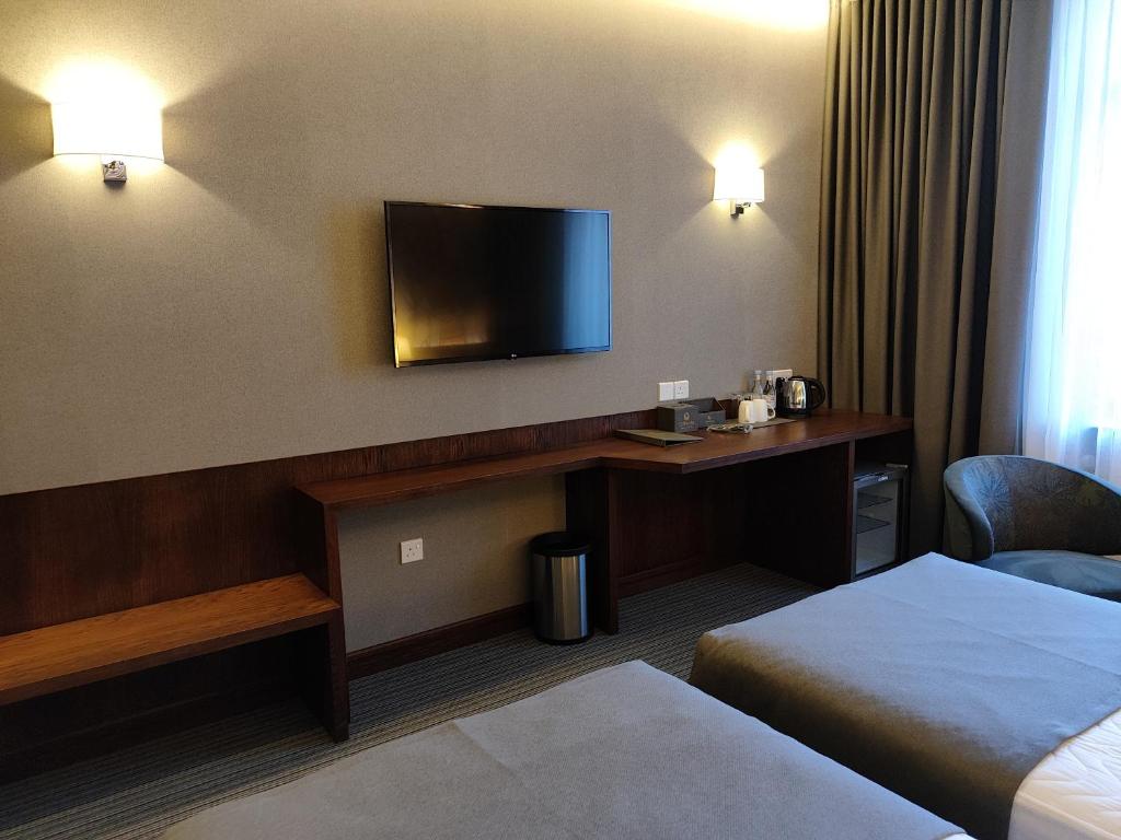 Postel nebo postele na pokoji v ubytování Orienta Hotel Gyumri