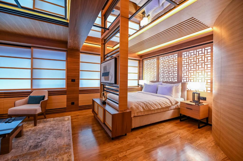 Postel nebo postele na pokoji v ubytování Hanami Design Hotel