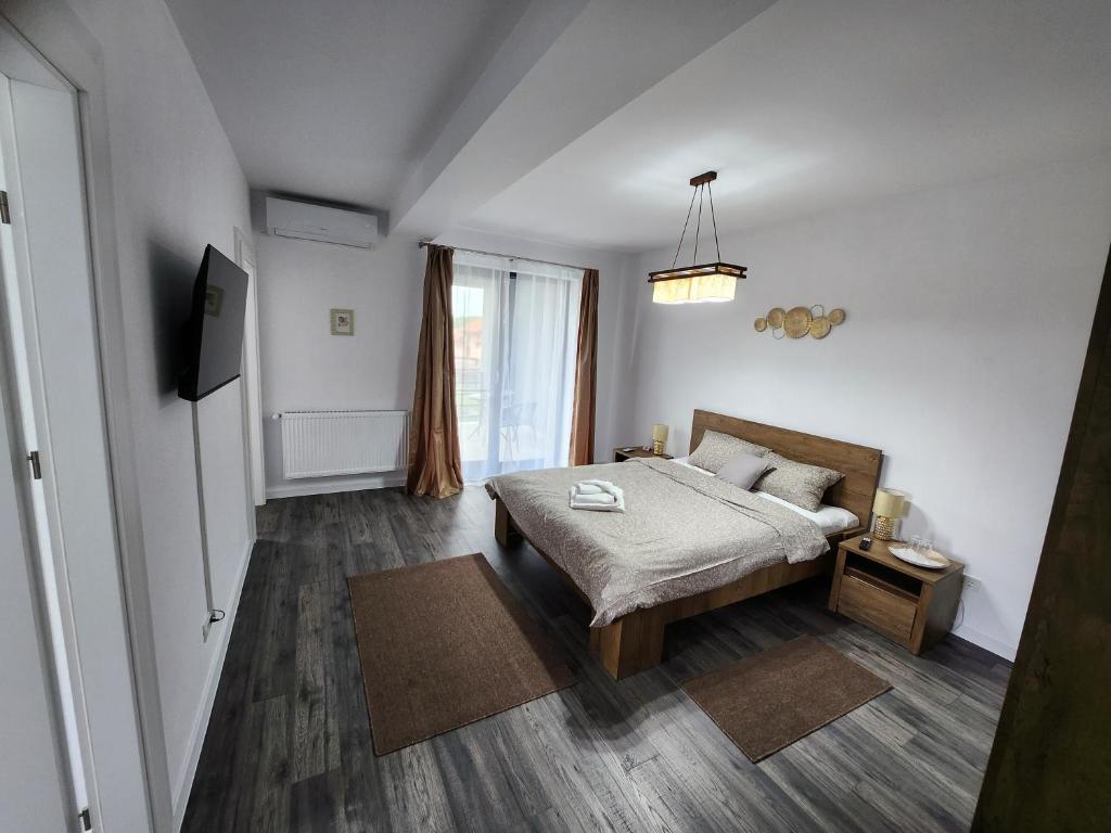 Postel nebo postele na pokoji v ubytování Armins's Residence 2 - Villa