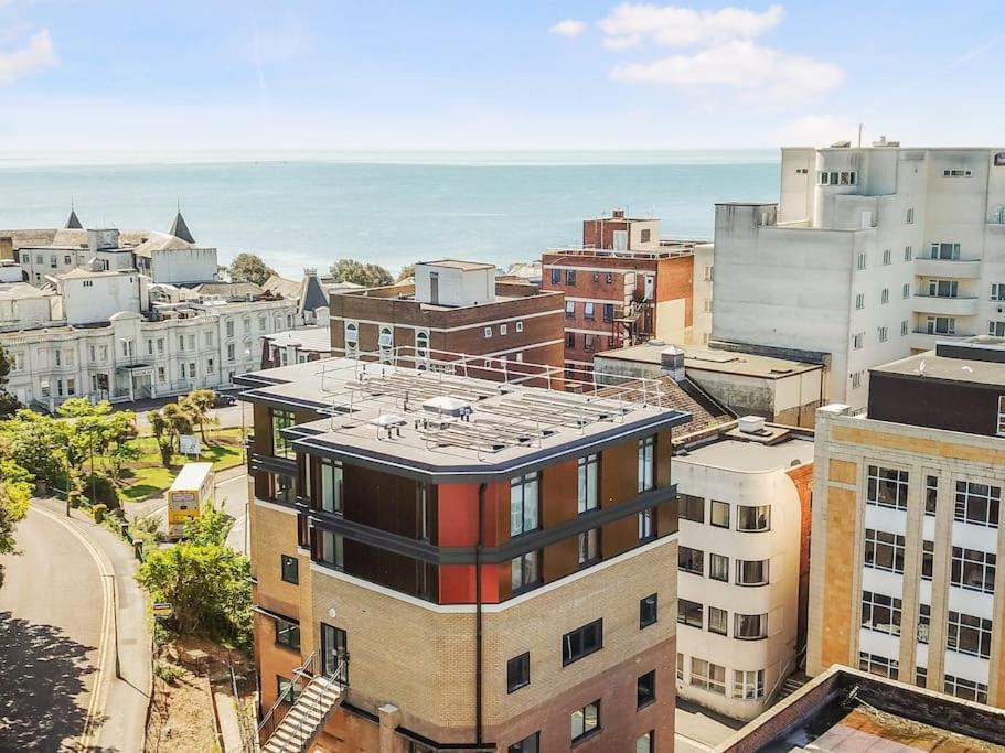 an aerial view of a city with the ocean at THE PAD by the beach Penthouse apartment with sunset and city views in Bournemouth