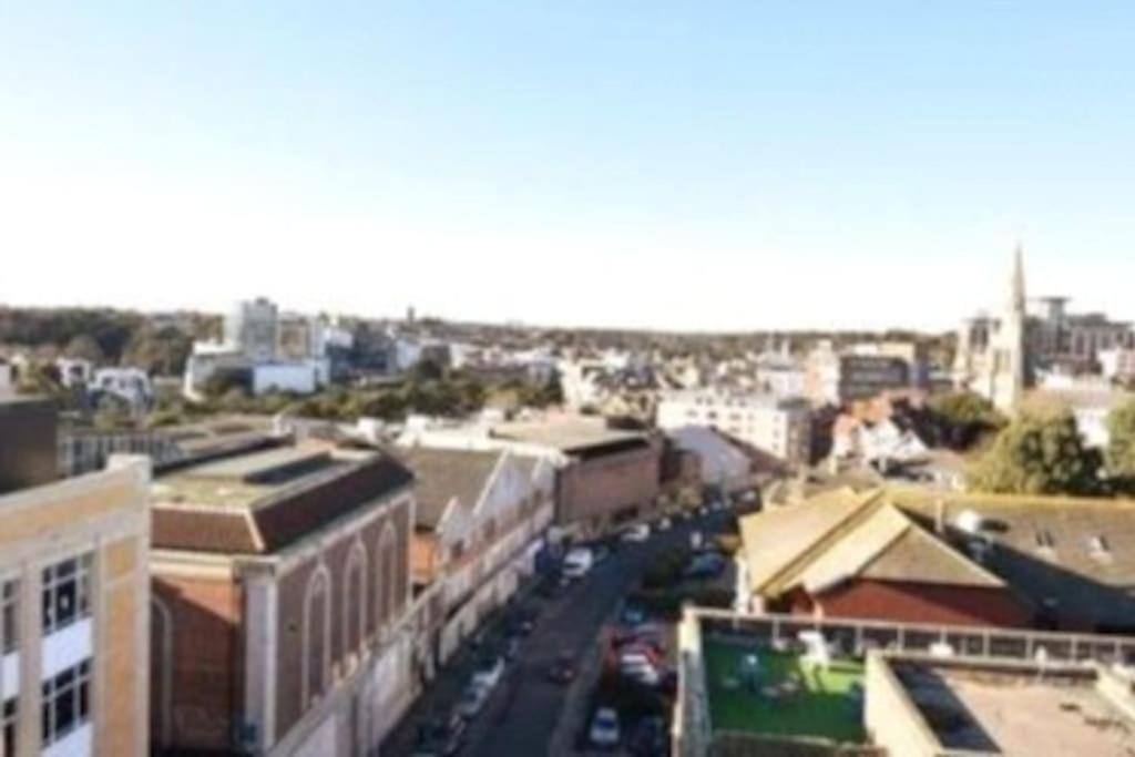 a view of a city with buildings and a street at THE PAD by the beach Penthouse apartment with sunset and city views in Bournemouth