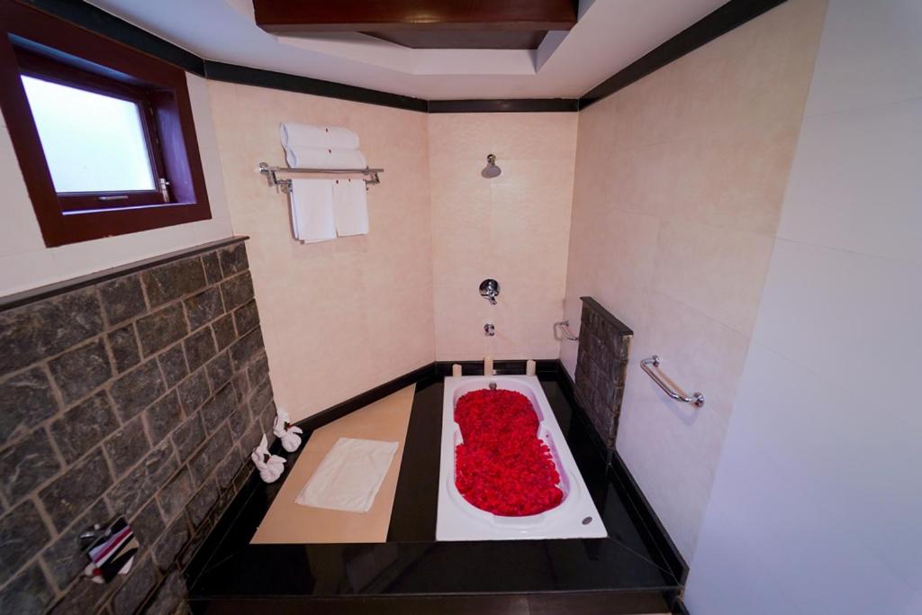 Postel nebo postele na pokoji v ubytování Hotel Kodai International