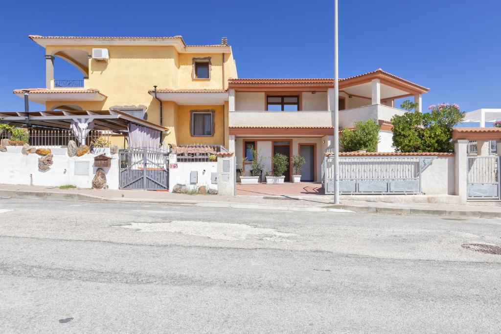 a house on the side of a street at Appartamento Tergu in Tergu