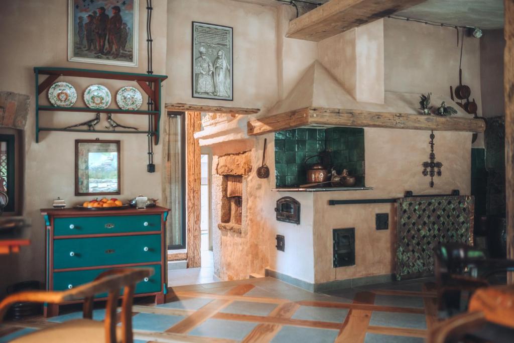 a kitchen with an old fashioned stove in a room at RESZTÓWKA in Polanica-Zdrój