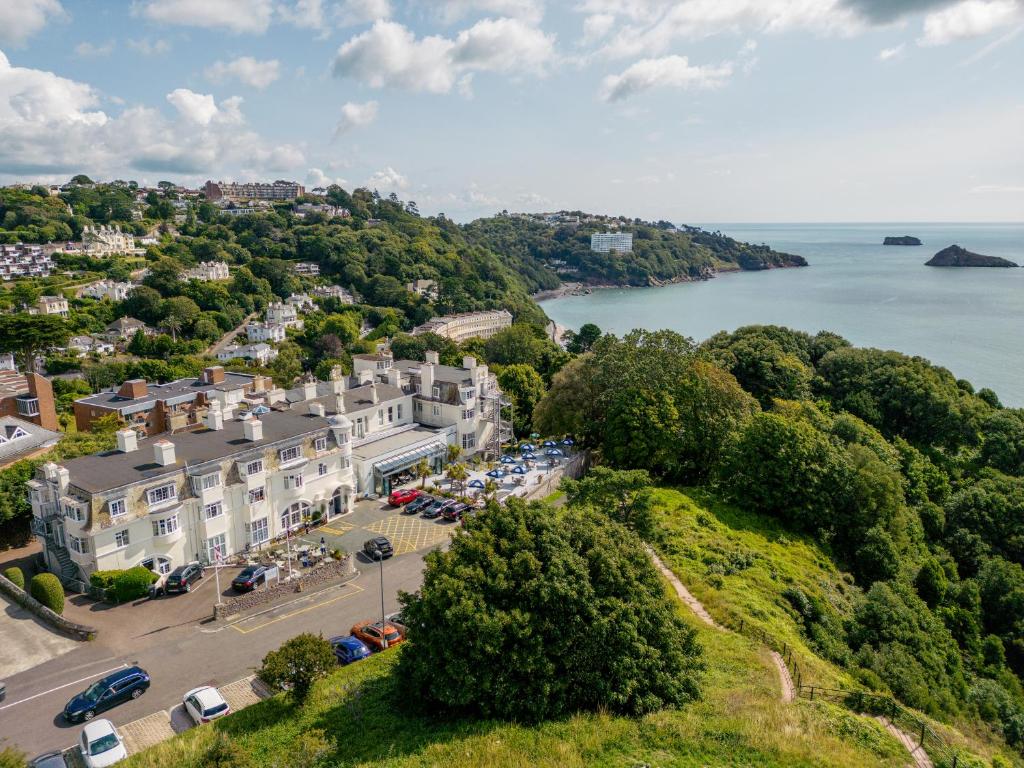 an aerial view of a town with the water at The Headland Hotel & Spa in Torquay