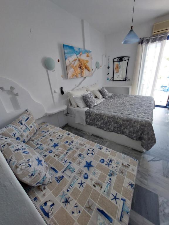 Postel nebo postele na pokoji v ubytování Doron Hotel Delfini