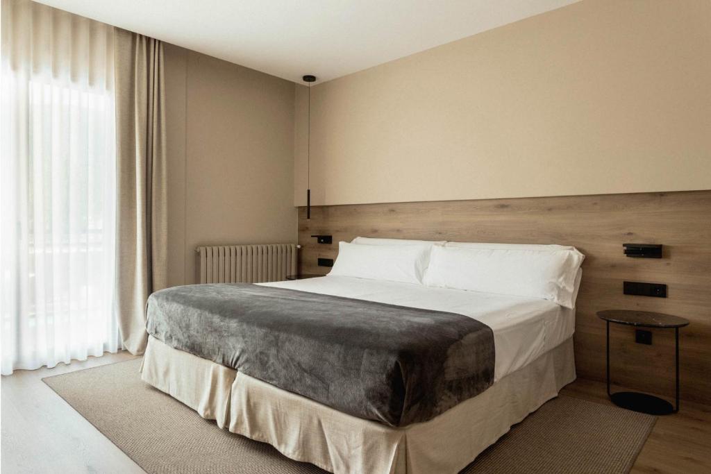 Postel nebo postele na pokoji v ubytování Hotel Terradets
