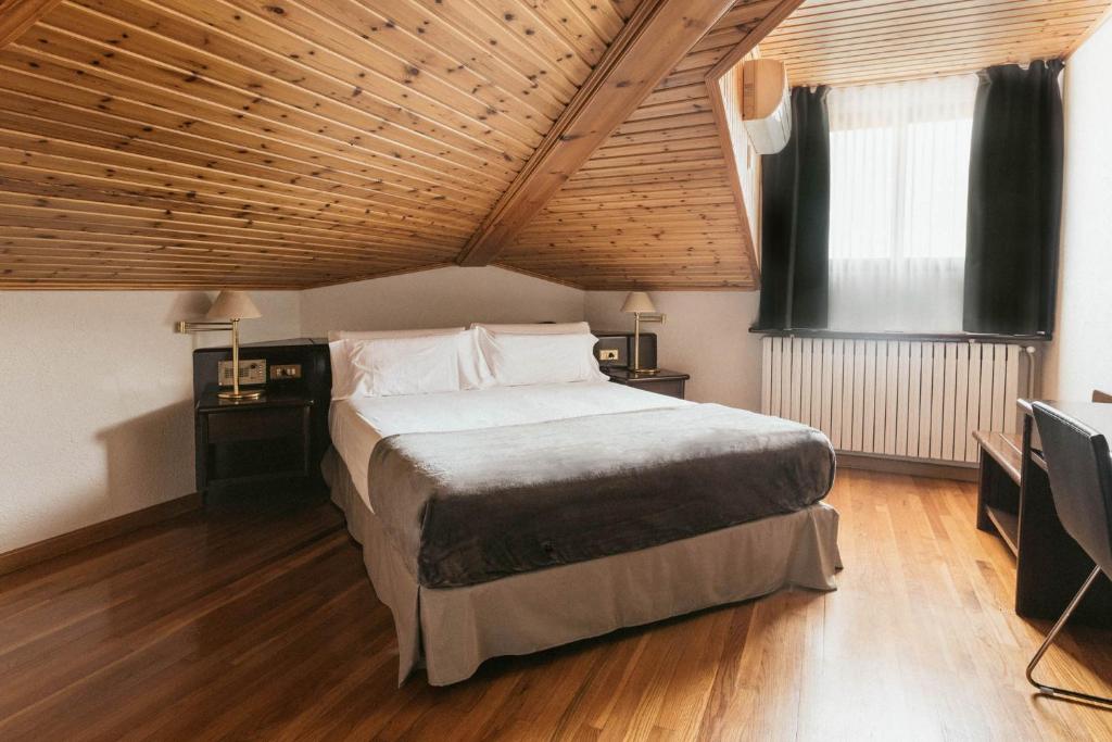 Postel nebo postele na pokoji v ubytování Hotel Terradets