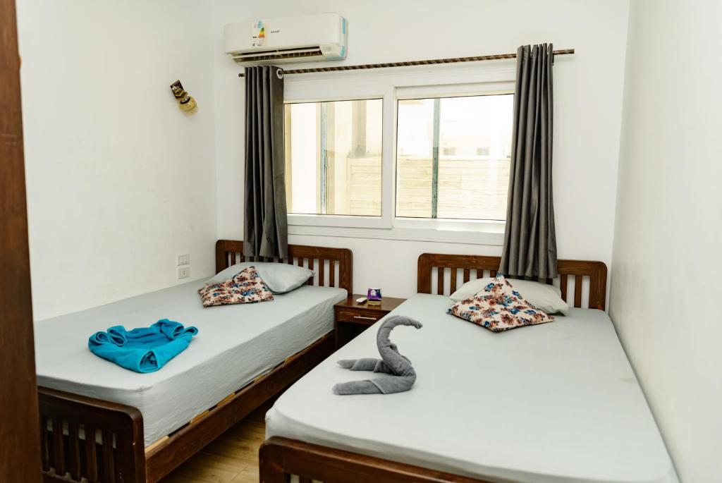 Кровать или кровати в номере Elite Residence Dahab