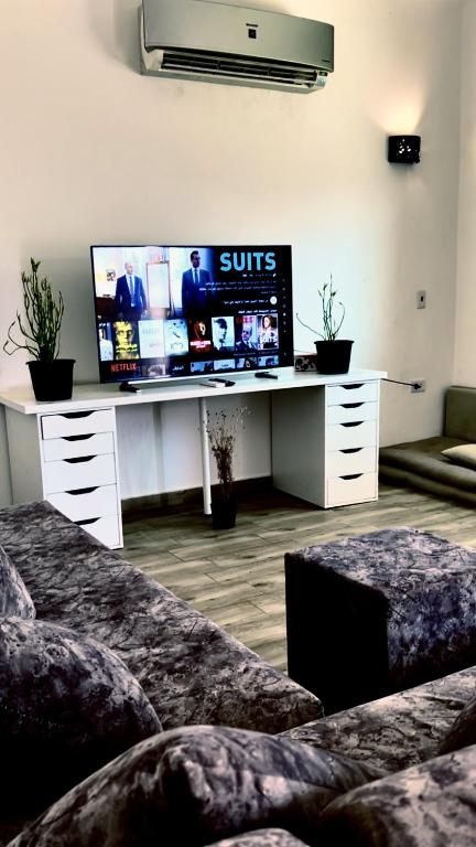 Телевизор и/или развлекательный центр в Elite Residence Dahab