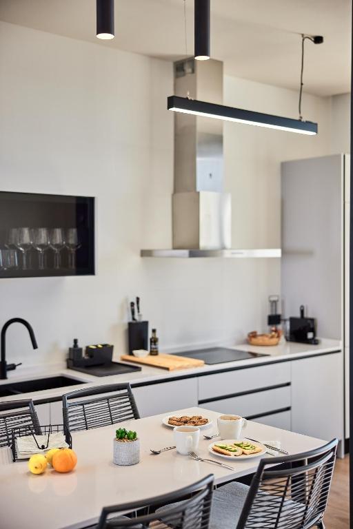 Kuchyň nebo kuchyňský kout v ubytování Ancón Suites