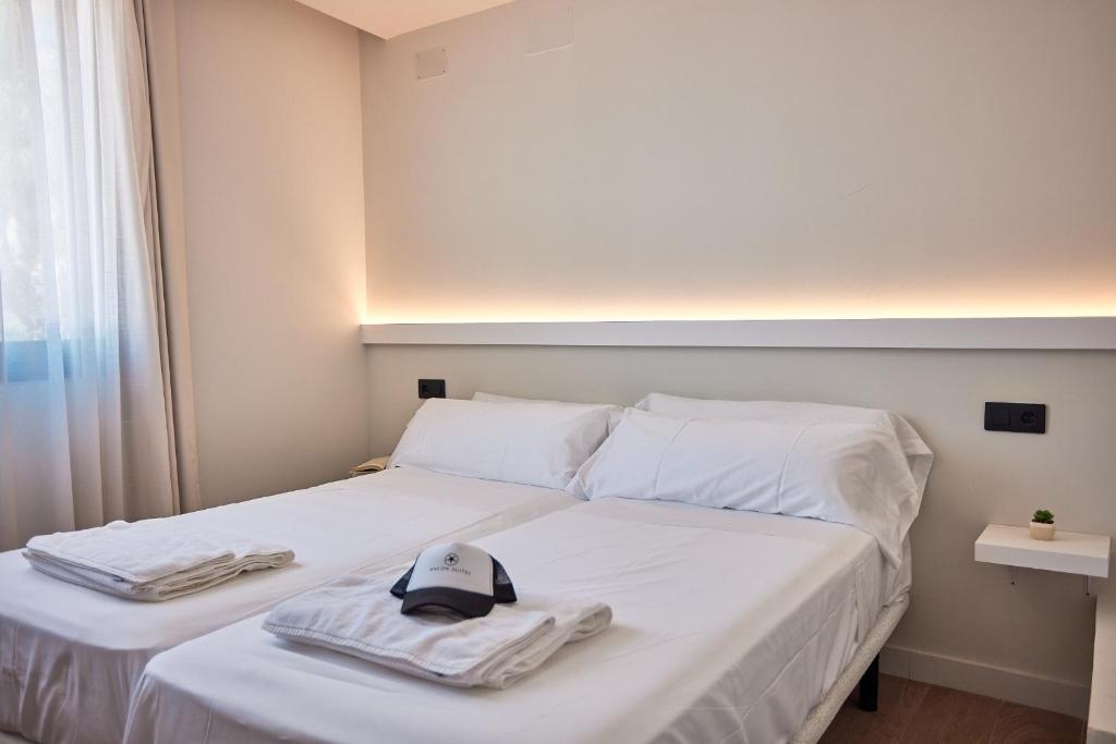 Postel nebo postele na pokoji v ubytování Ancón Suites