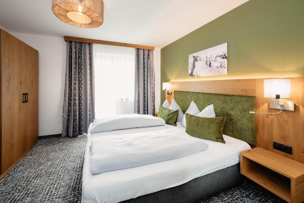 Postel nebo postele na pokoji v ubytování Hotel Schützenhof