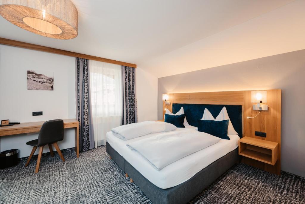 Postel nebo postele na pokoji v ubytování Hotel Schützenhof