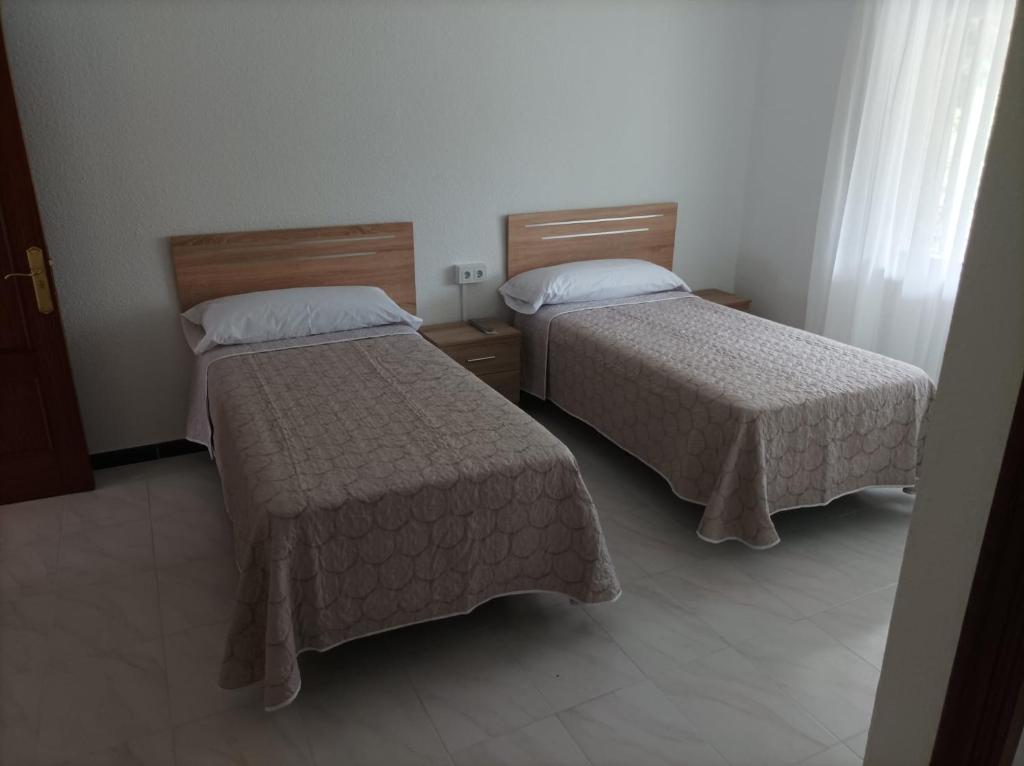 Ένα ή περισσότερα κρεβάτια σε δωμάτιο στο El Ferial