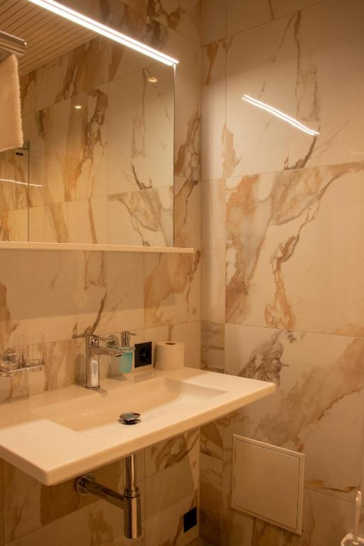 Koupelna v ubytování AMANTE Hotel