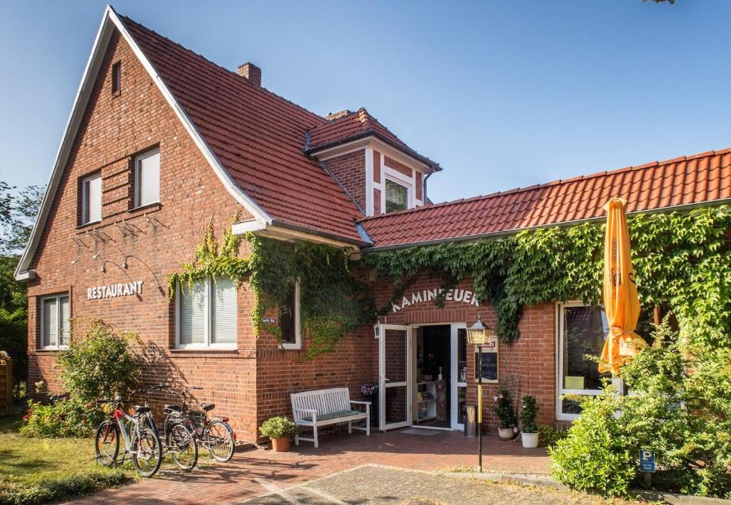 a brick house with bikes parked outside of it at Ferienwohnung Klein & Fein in Güstrow