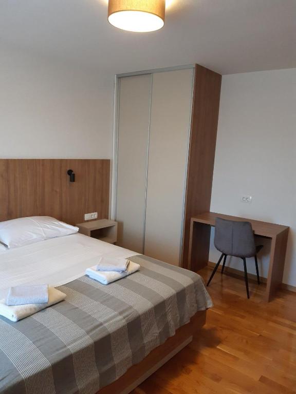 Postel nebo postele na pokoji v ubytování Apartments Mare