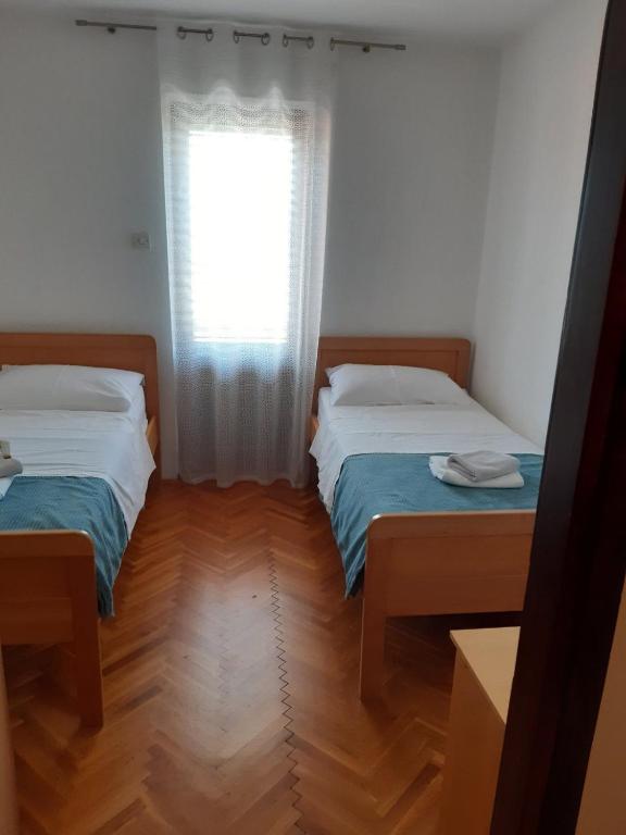 Postel nebo postele na pokoji v ubytování Apartments Mare