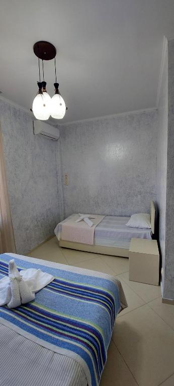 Postel nebo postele na pokoji v ubytování Hotel Ergo