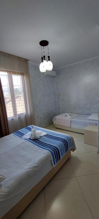 Postel nebo postele na pokoji v ubytování Hotel Ergo