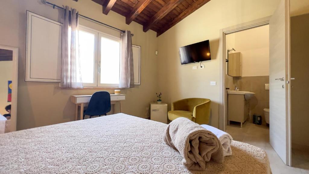 Postel nebo postele na pokoji v ubytování La Corte di Afea