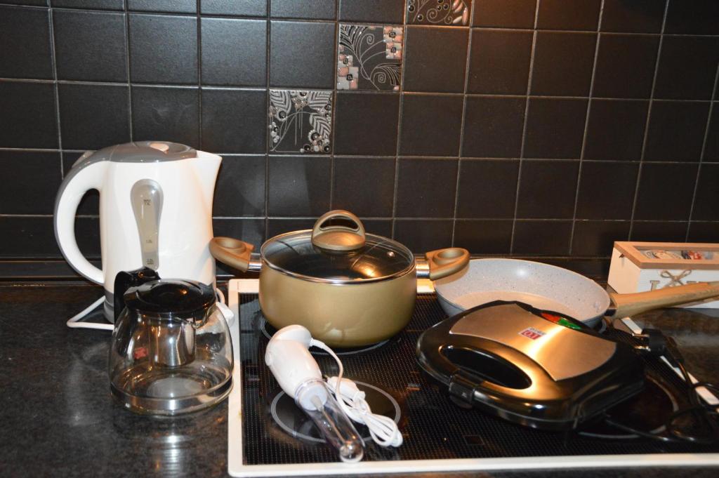 Příslušenství pro přípravu čaje a kávy v ubytování Elite Suites