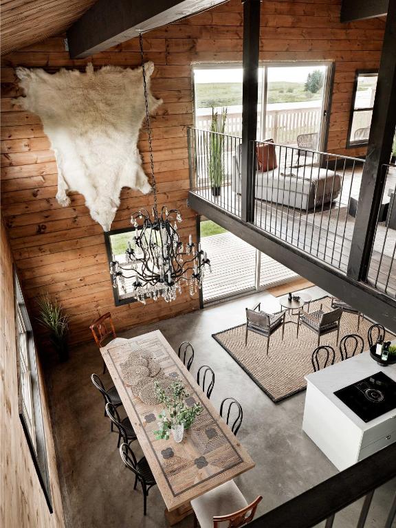 an overhead view of a living room with a table and chairs at Laxá Lodge in Hella