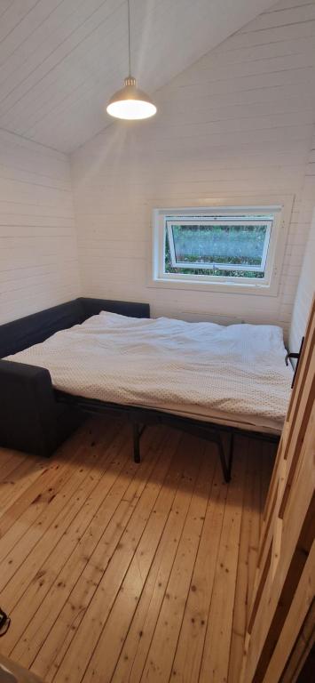 Postel nebo postele na pokoji v ubytování Tinymansion