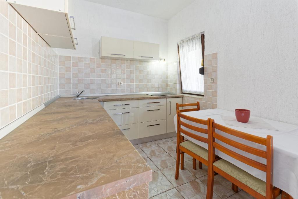 Kuchyň nebo kuchyňský kout v ubytování Apartments Exotica by Rent Istria