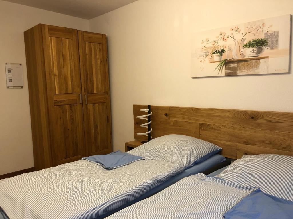Postel nebo postele na pokoji v ubytování Gästehaus Jagsttal