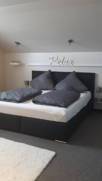 מיטה או מיטות בחדר ב-Ferienhaus-Auszeitgeniessen