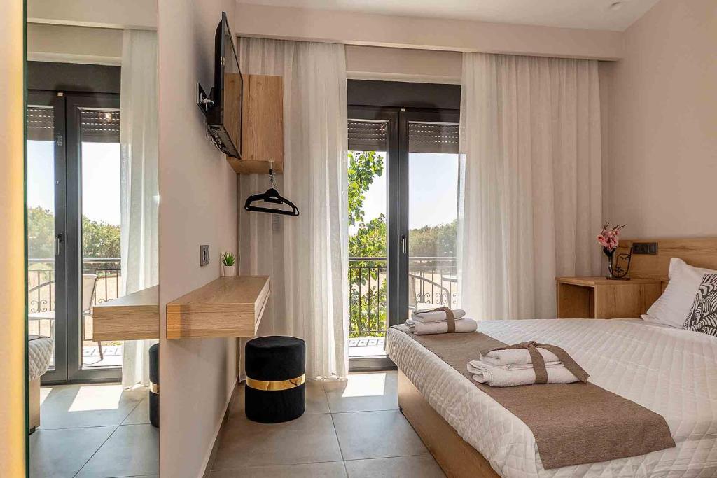 Postel nebo postele na pokoji v ubytování Fragkos Doukas Rooms