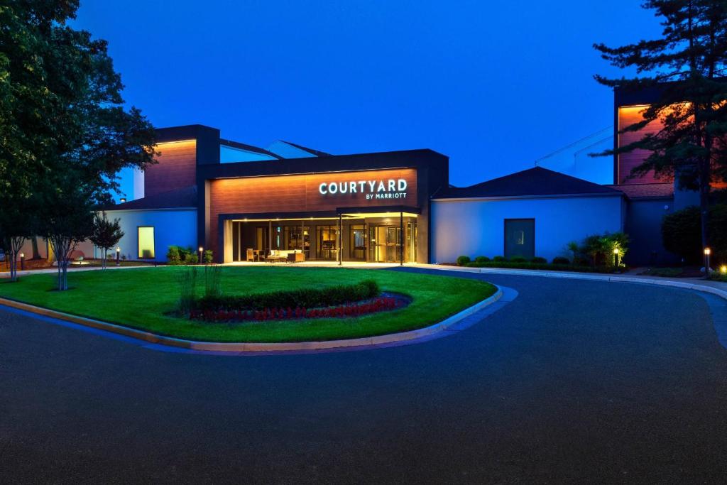 a building with a sign on the front of it at Courtyard by Marriott Dulles Airport Herndon/Reston in Herndon